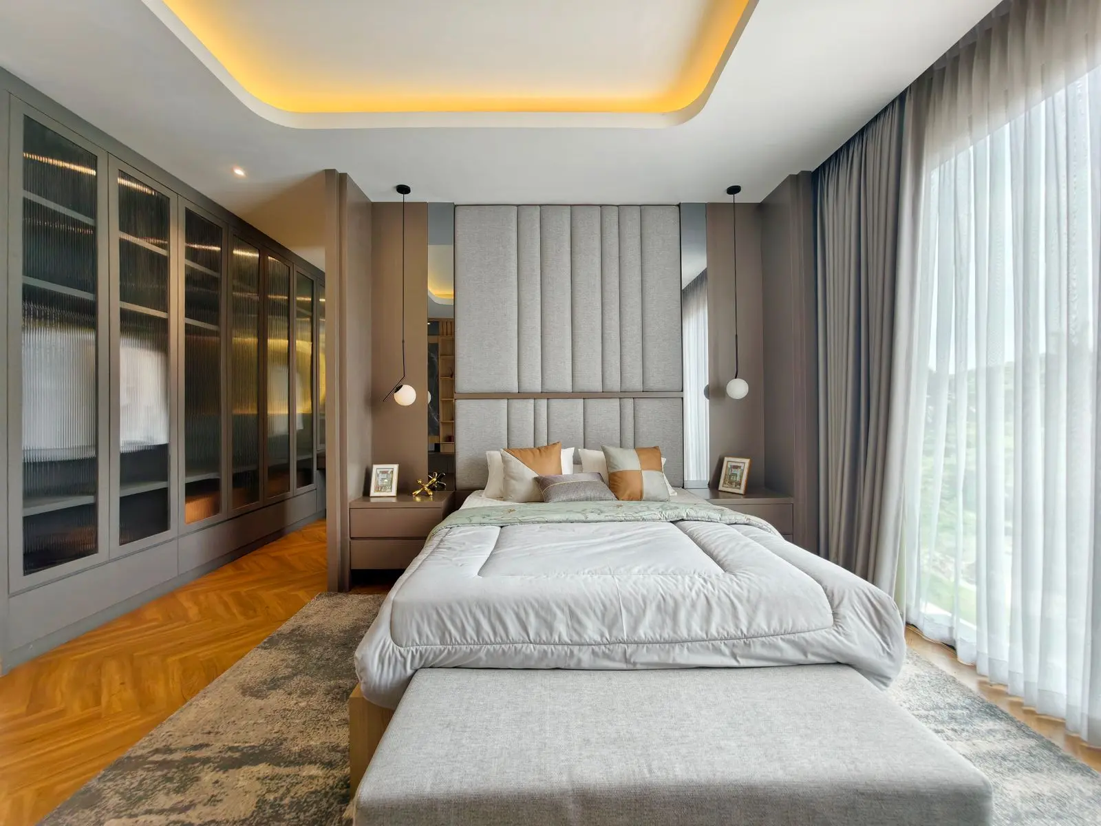 Sunlit modern bedroom with a wall of large windows