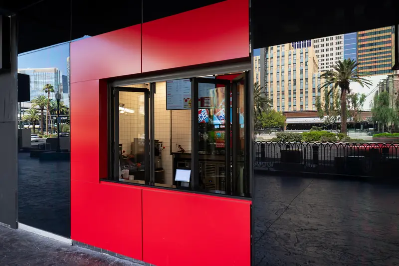 Panda® FTS.60 folding window open as a walk-up counter at a Five Guys on the Las Vegas Strip