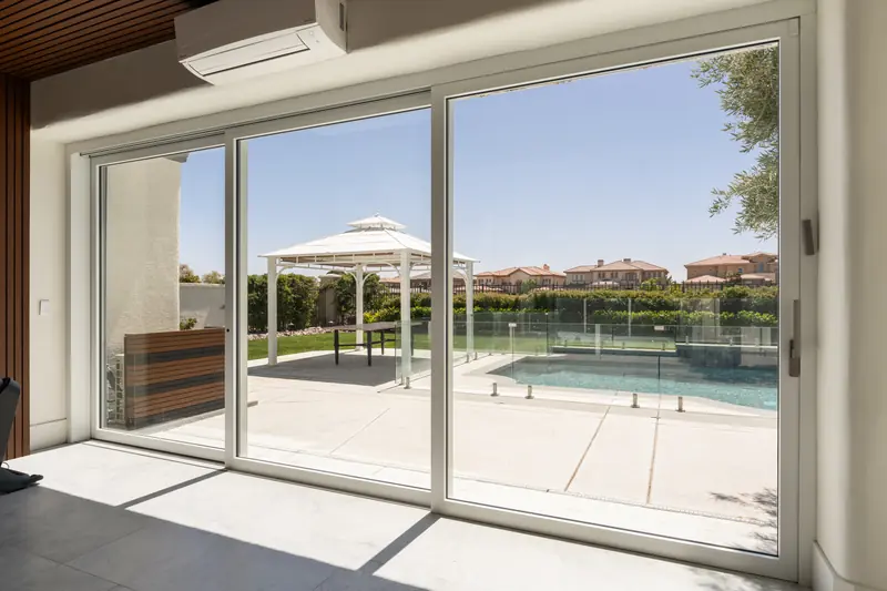 Wide Panda® sliding doors opening onto a pool terrace at a Las Vegas residence