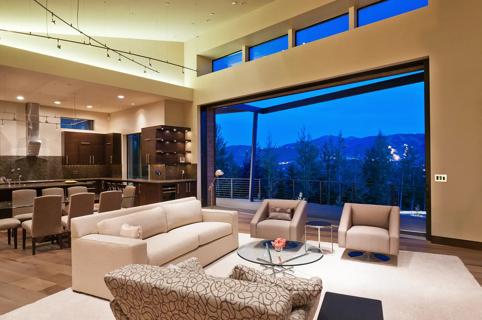 Panda® lift and slide doors fully open across a great room corner onto a mountain-view deck in Park City, Utah