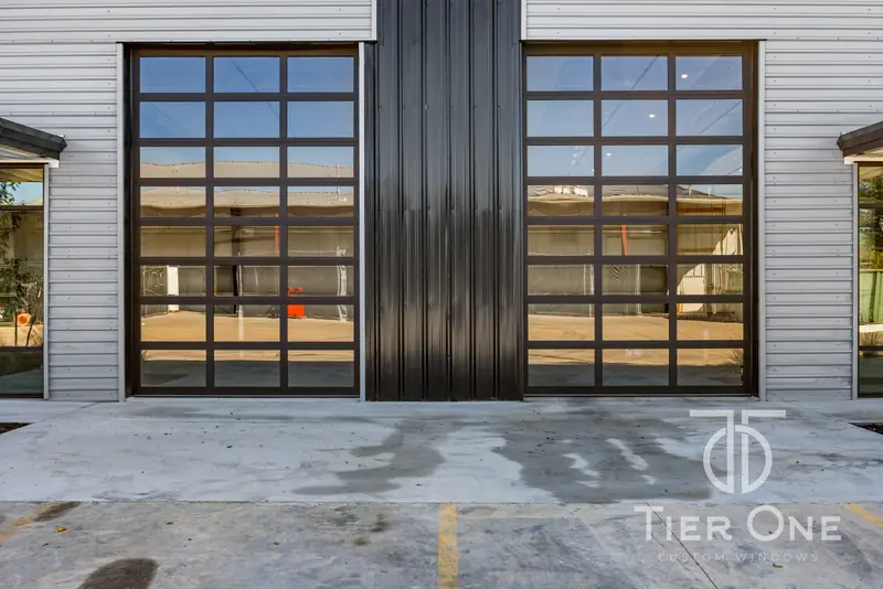 Pair of full-view aluminum and glass overhead doors