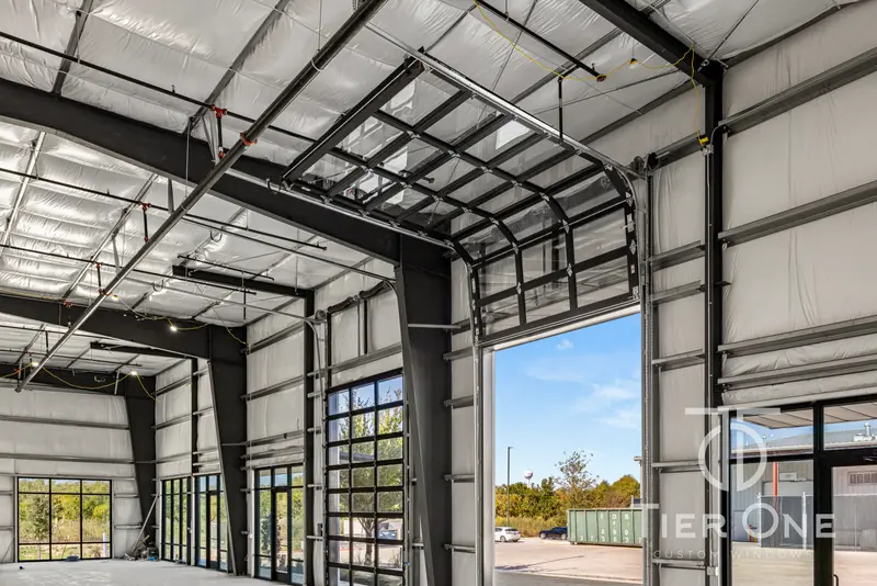 Glass overhead door raised in a warehouse bay
