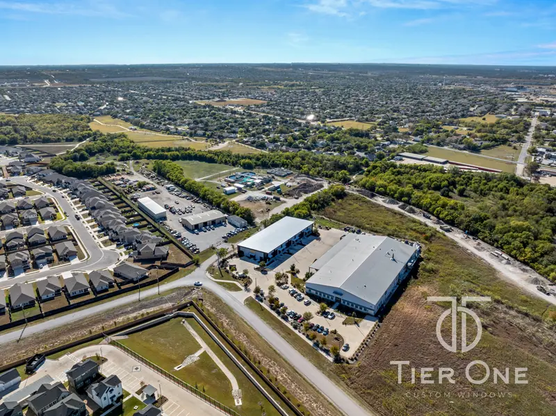 High aerial view of the building within its surrounding neighborhood