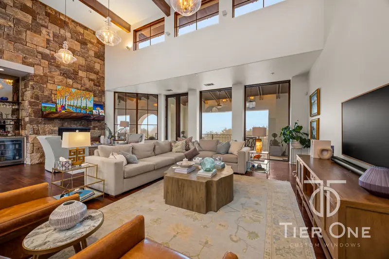 Two-storey great room with clerestory windows and glass doors to the terrace