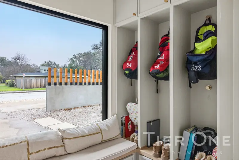 Black-framed picture window over a built-in bench seat