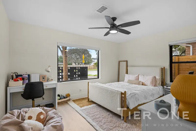 Black-framed window above a desk in a child's bedroom