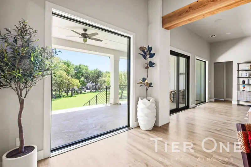 Large picture window and sliding doors across a living room