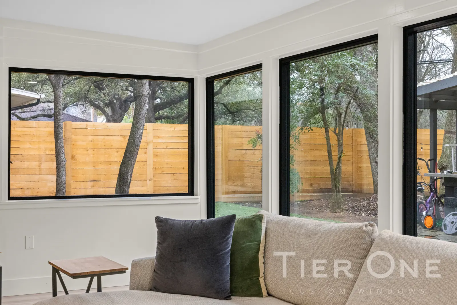 Black-framed windows carried around the corner of a living room